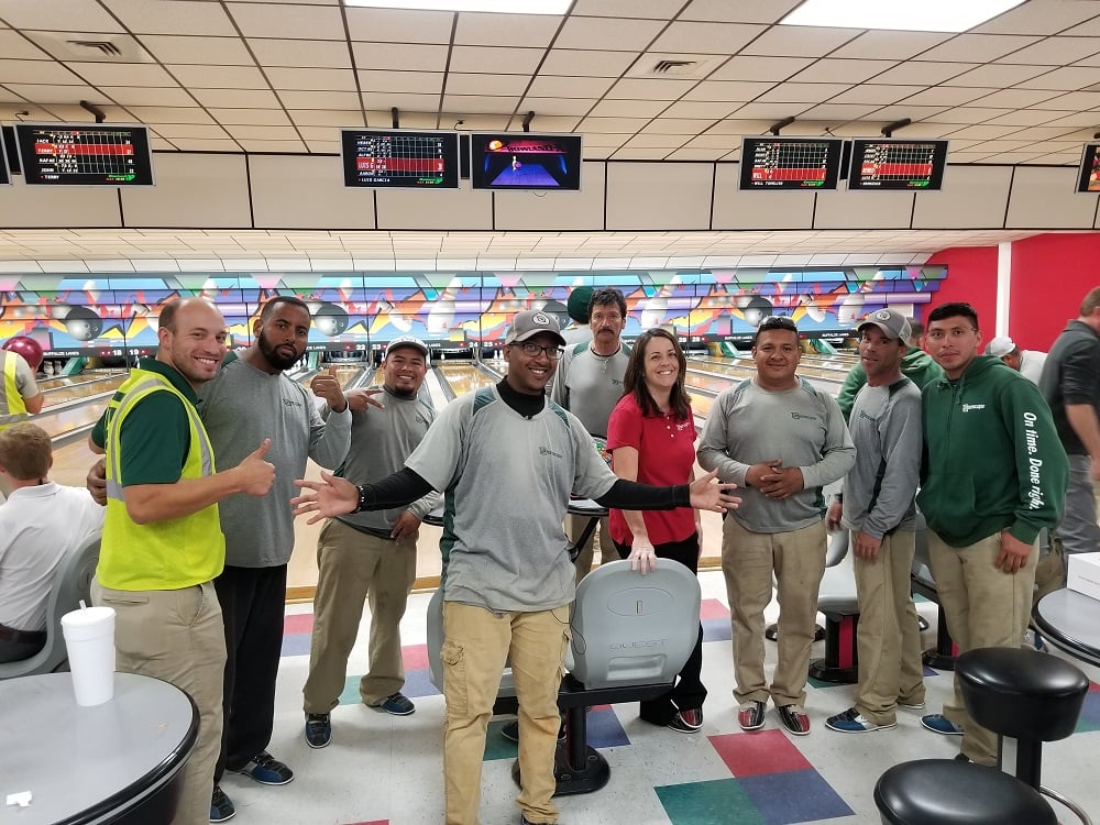 Greenscape landscaping team having fun at bowling party
