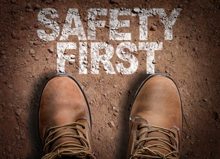 Boots on landscape safety first text